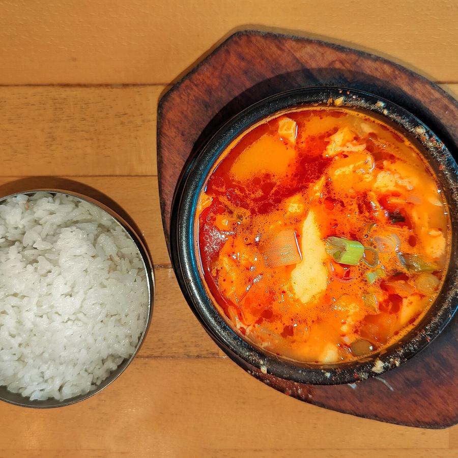 Soft-tofu stew with a bowl of steamed rice